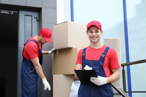 Removal team handling furniture carefully during a Knightsbridge home move