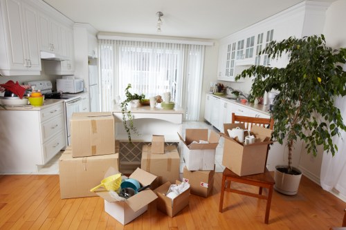 Arranged removal boxes and protected furniture ready for a Knightsbridge relocation