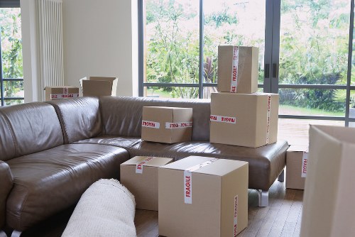 Professional movers loading office items in central London