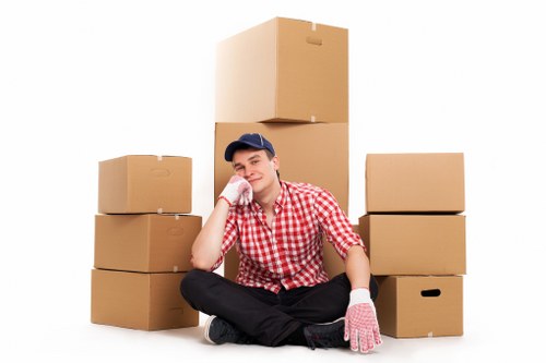 Local Knightsbridge removal crew handling boxes and furniture with care