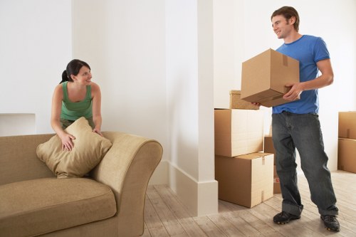 Packed boxes and furniture in a central London apartment move